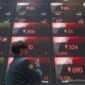 IHSG Berfluktuasi: Saham Komoditas Menyeret, Investor Waspada!